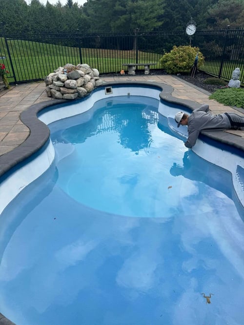 A fiberglass pool that has faded and gone white from high PH levels causing extreme chalking of the gel coat surface