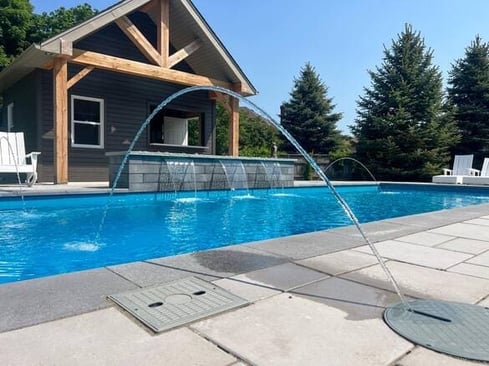 Dolphin fiberglass pool with water feature in Kitchener, ON