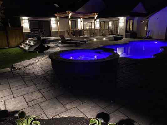 fiberglass pool with attached spa