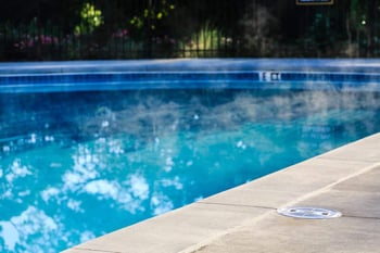 How much water can evaporate from a pool in a day?